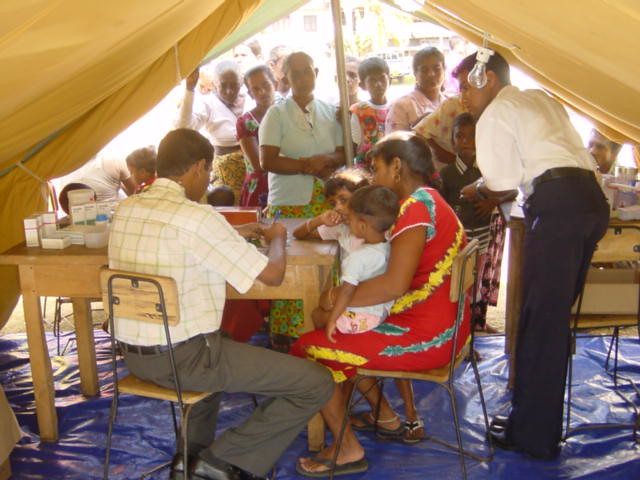 Doctor distributing medicine at a Sarvodaya camp