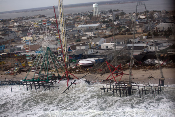 An image of hurricane damage to New Jersey's barricade islands, including a damaged farris wheel