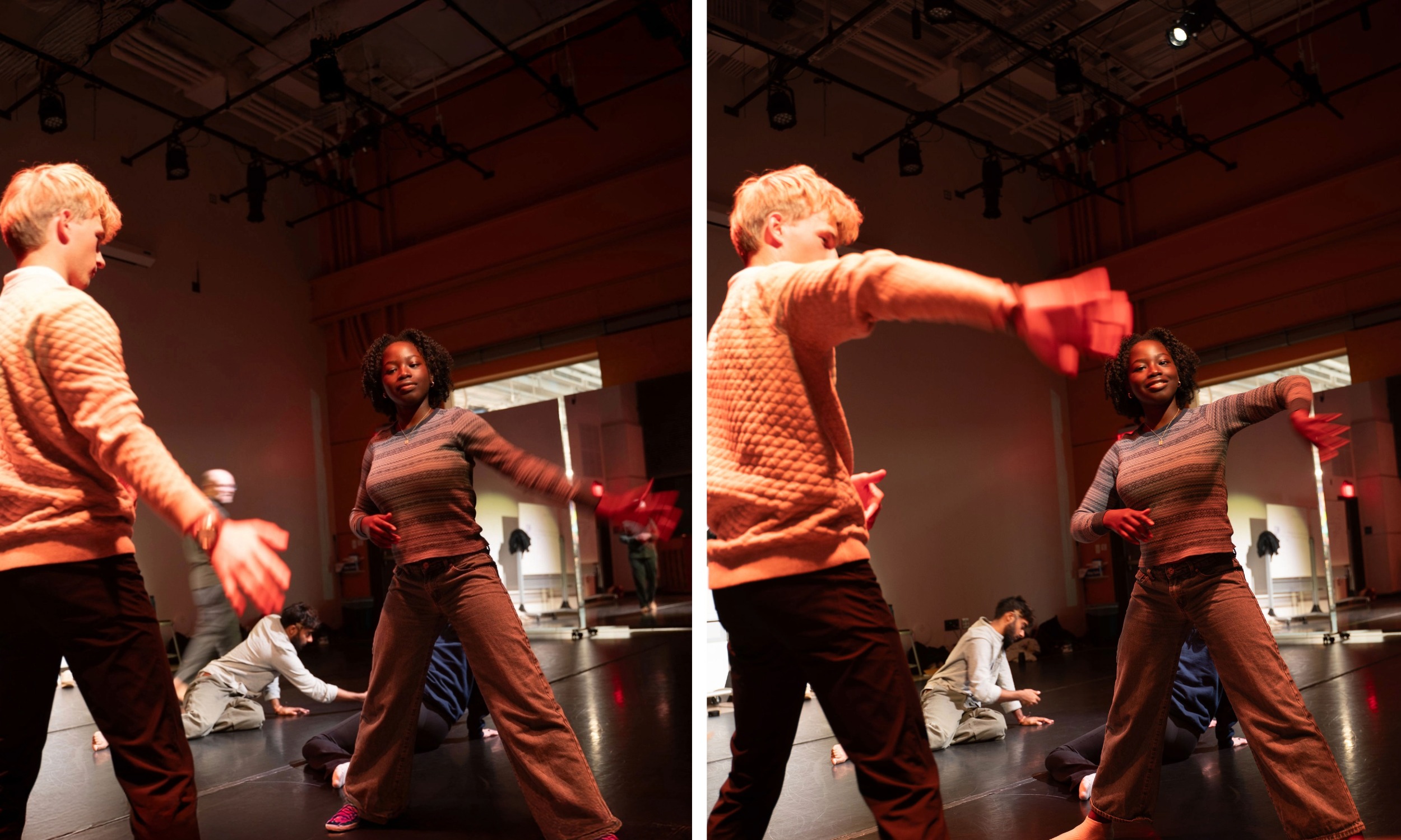 Two students moving in tandem in a dance studio