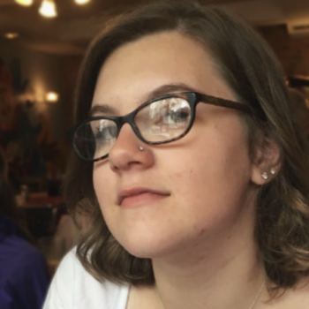 Kate Turner (she/her) is a doctoral candidate in English and studies the nineteenth-century British novel, queer theory, Marxist critical theory, and Gothic and sensation fiction. Her dissertation project deals with the relationship between Gothic fiction, theories of justice, and historical time. Teaching is her favorite part of academia: at Duke, she has taught an introductory writing course on children’s fiction and an English course on Gothic romance. She holds a B.A. in English and Critical Social Thought from Mount Holyoke College and credits her time there with her lifelong love of teaching and mentorship. Headshot of Kate Turner