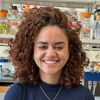 Clara dos Santos is a Ph.D. candidate in the Biology Department with a strong background in molecular biology and biochemistry. Her research focuses on understanding how disruptions in ubiquitin-mediated regulation impact cellular metabolism, using integrative multi-omics approaches. Clara is particularly interested in how fundamental biological mechanisms translate into human health and disease. As an educator and mentor, she is passionate about supporting students from diverse backgrounds in STEM and believes mentorship is essential for building inclusive and collaborative scientific communities. Clara completed her undergraduate education in Brazil, where she developed a strong interest in scientific communication and education. Headshot of Clara dos Santos